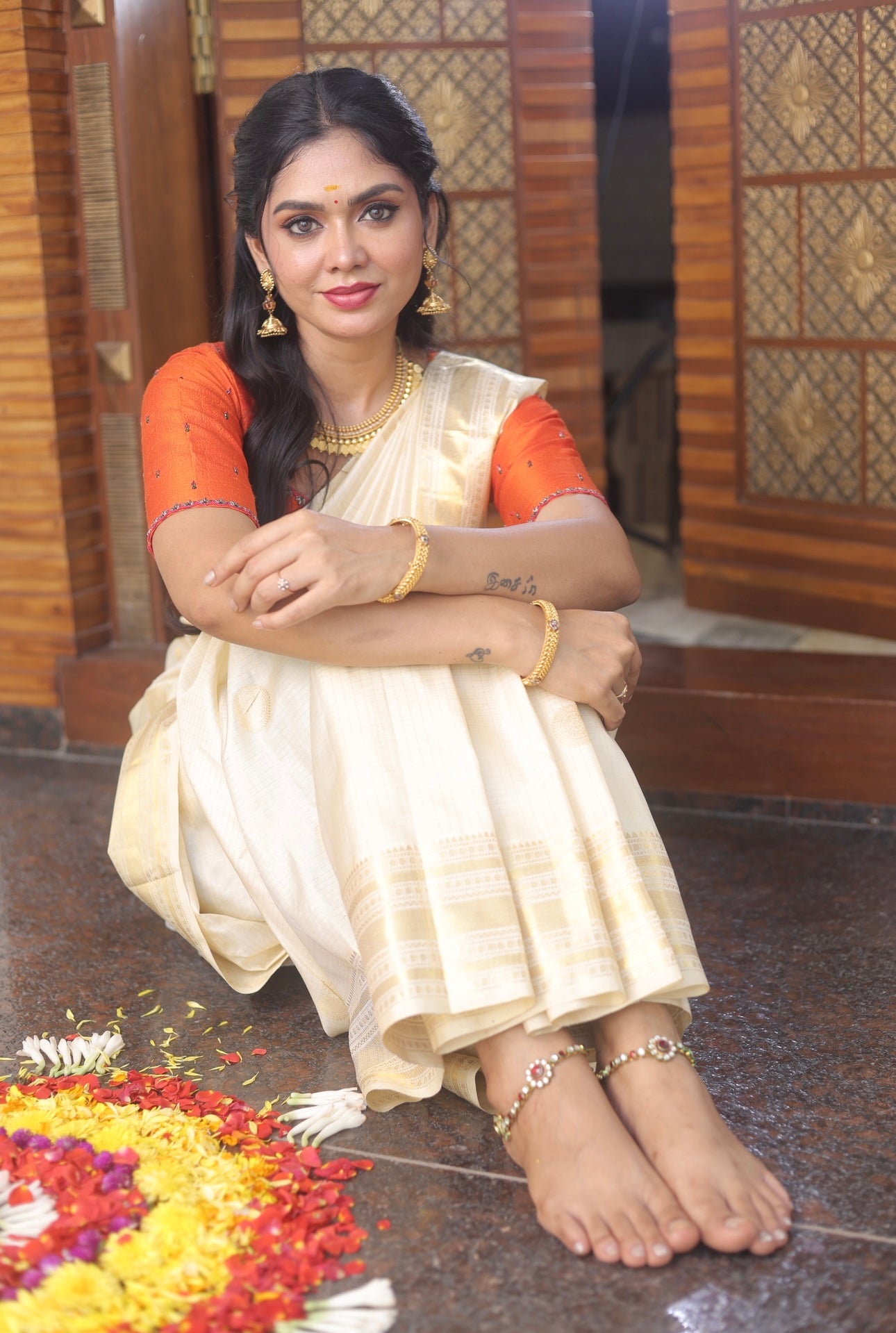 Kerala style Kanchivaram silk saree with golden zari weaves.