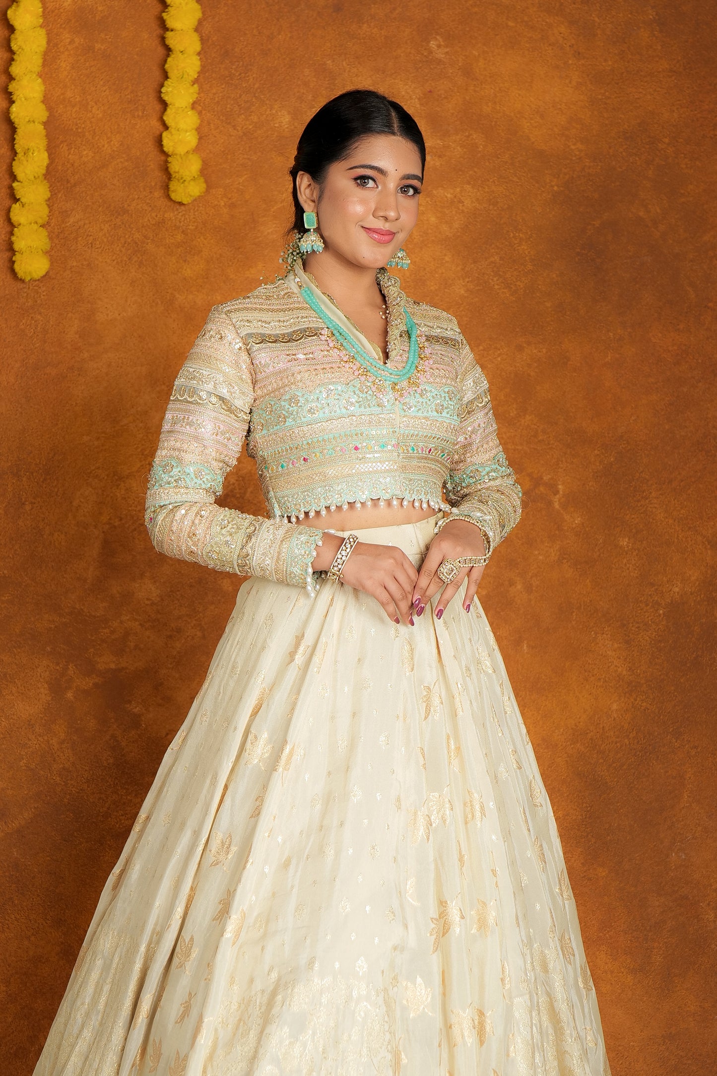 Banarasi lehenga paired with intricately embroidered crop top.