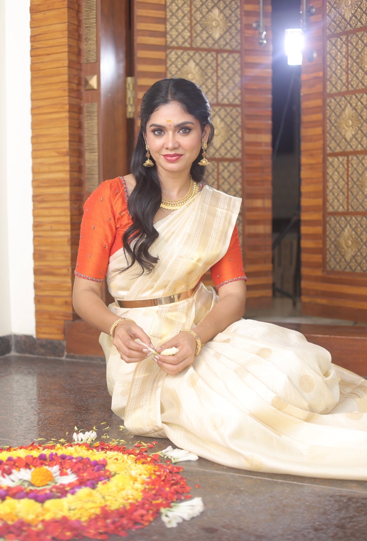 Kerala style Kanchivaram silk saree with golden zari weaves.