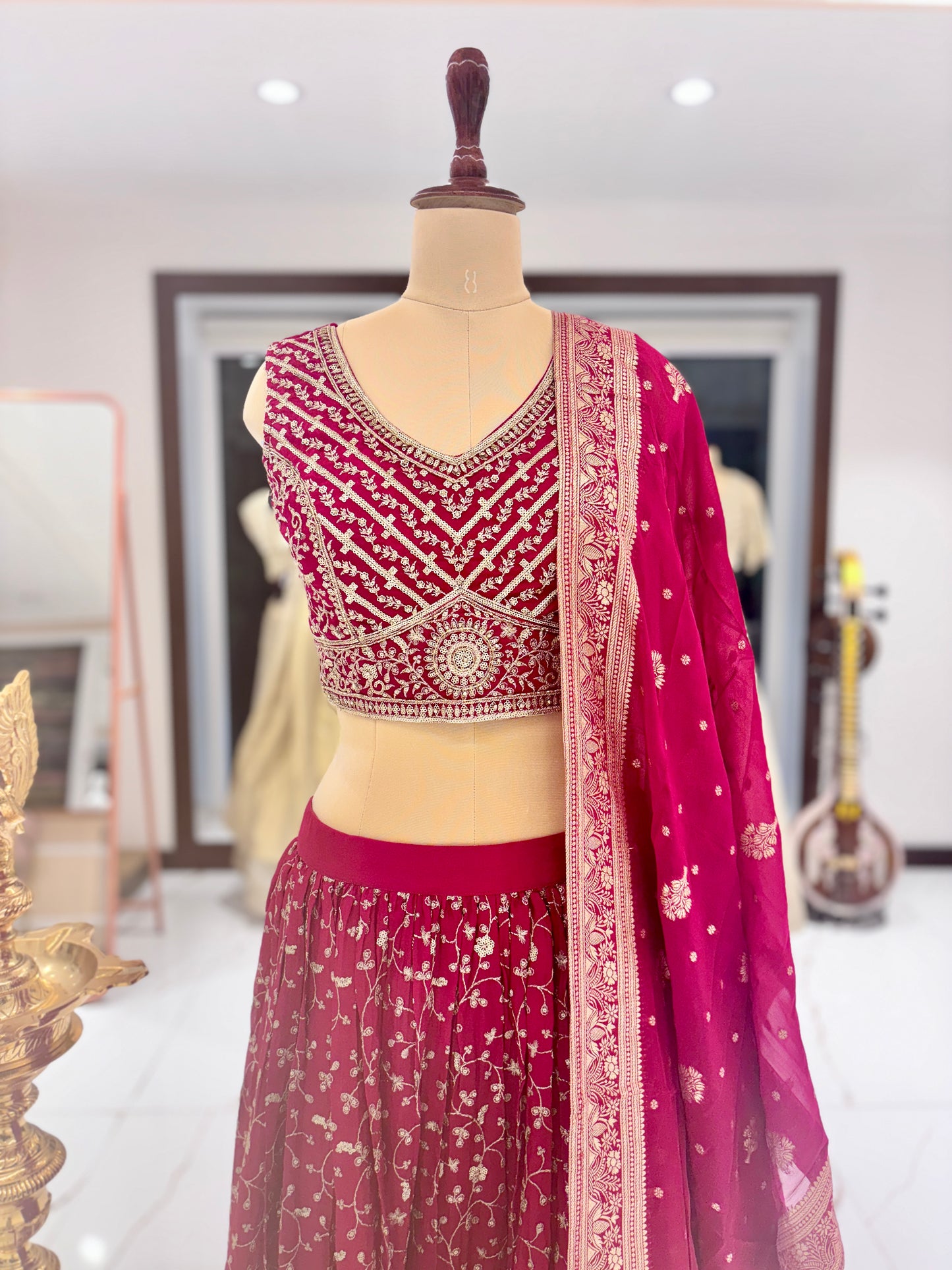 Red designer lehenga from Meshira