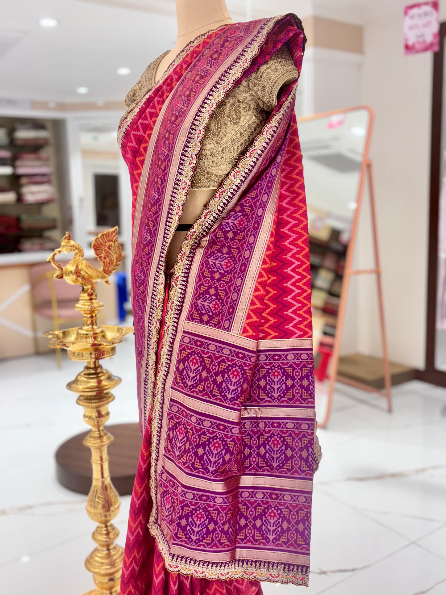 Pink Pattola Silk Saree with embroidery.
