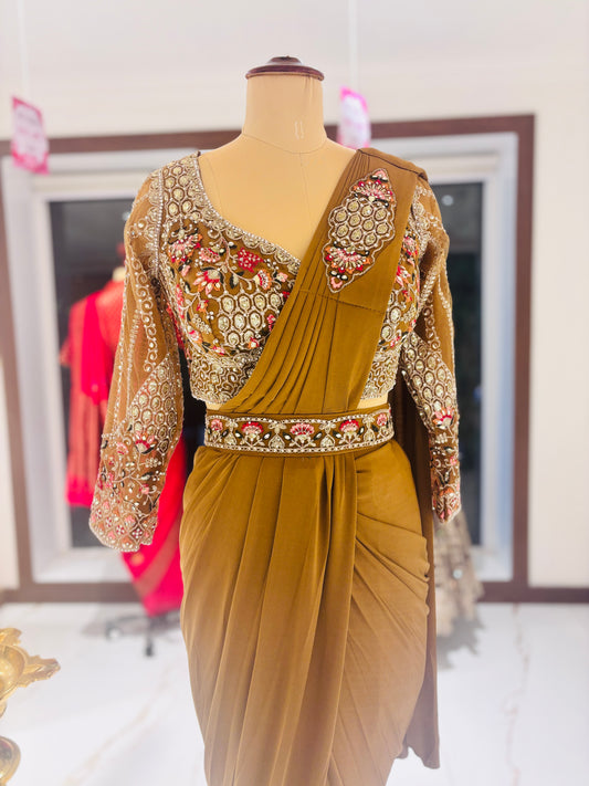 Gold ready made Saree with embroidered blouse.