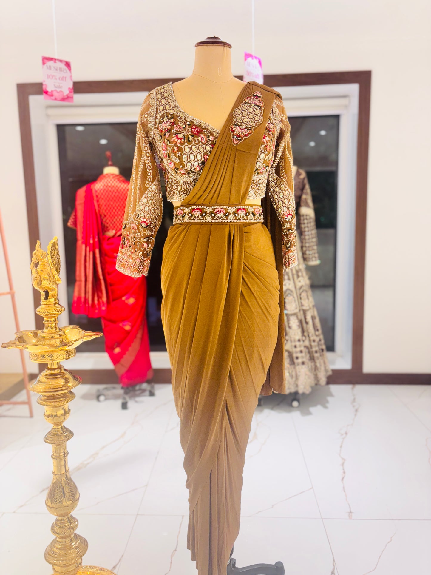 Gold ready made Saree with embroidered blouse.
