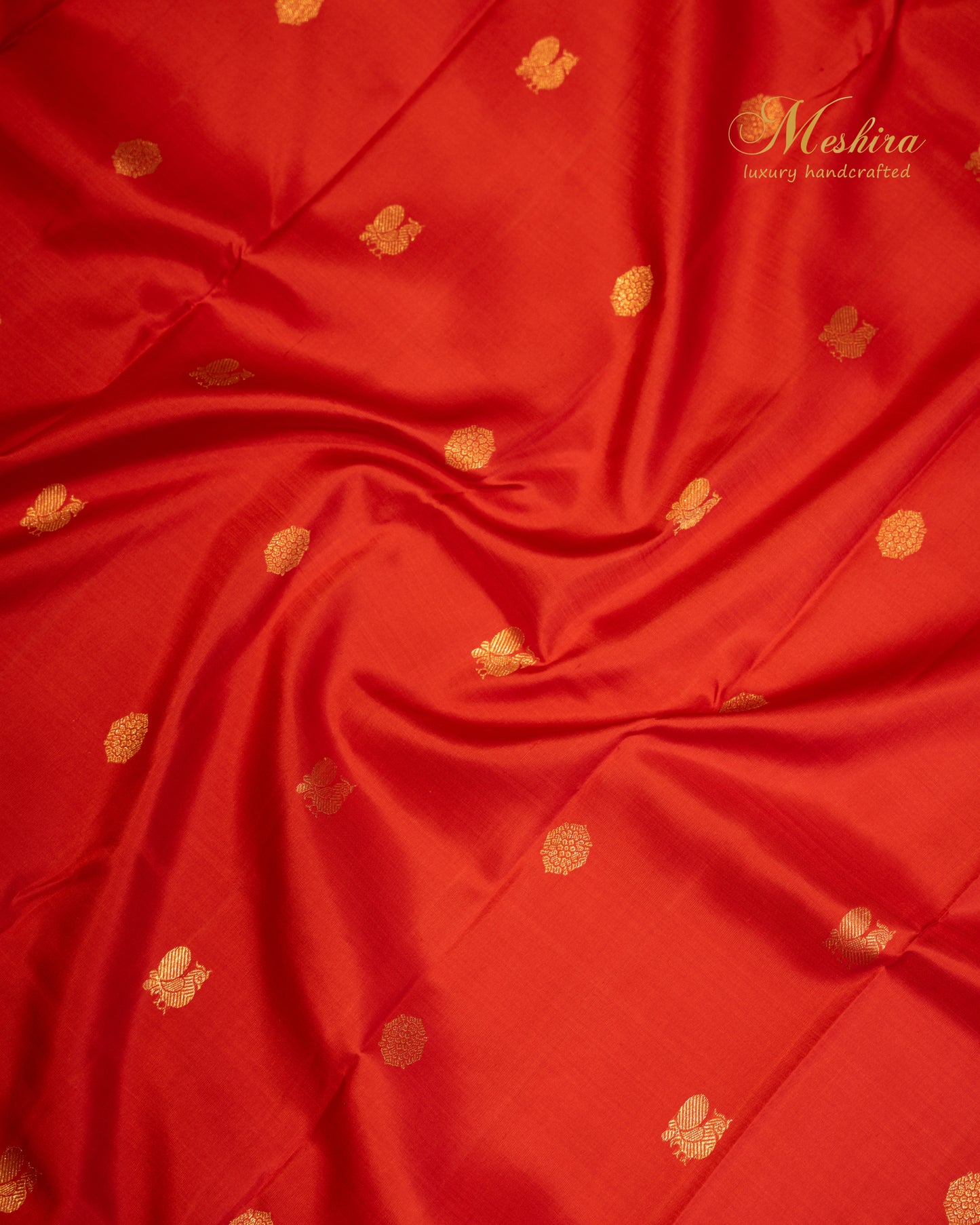 Crimson red Kanchivaram silk saree with black striped silver zari border.
