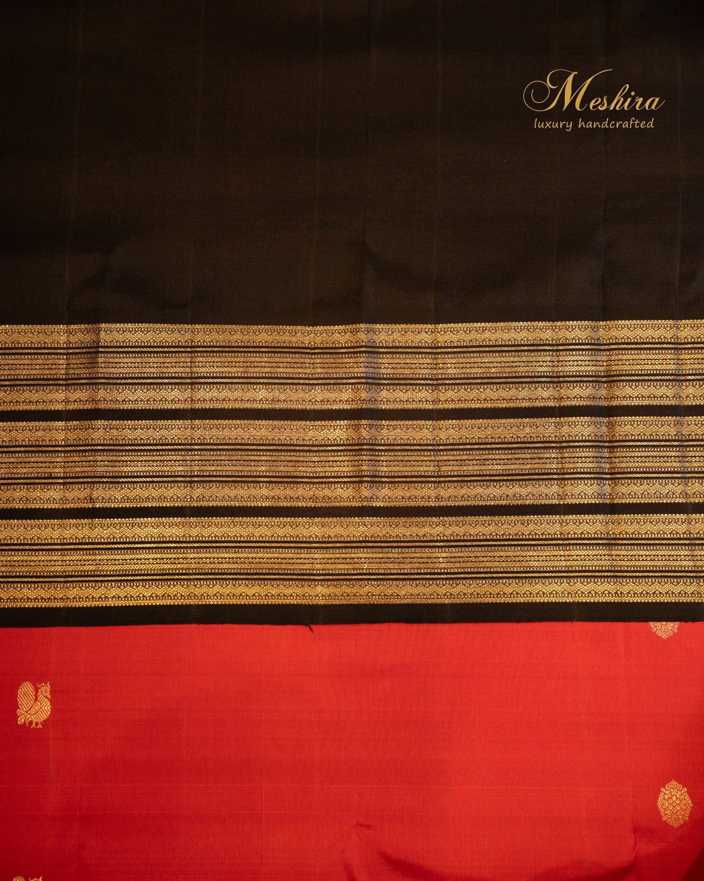 Crimson red Kanchivaram silk saree with black striped silver zari border.