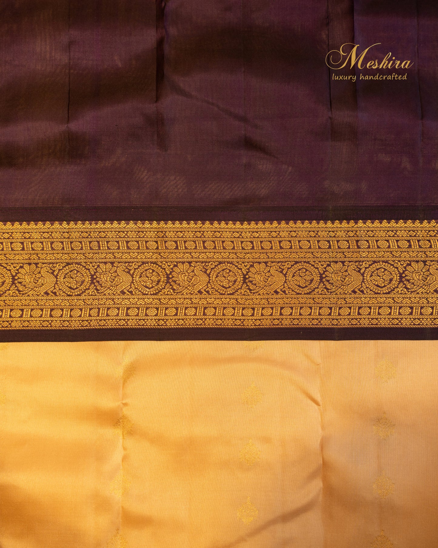 Elegant Kanchivaram silk saree in golden yellow body and rich black border.