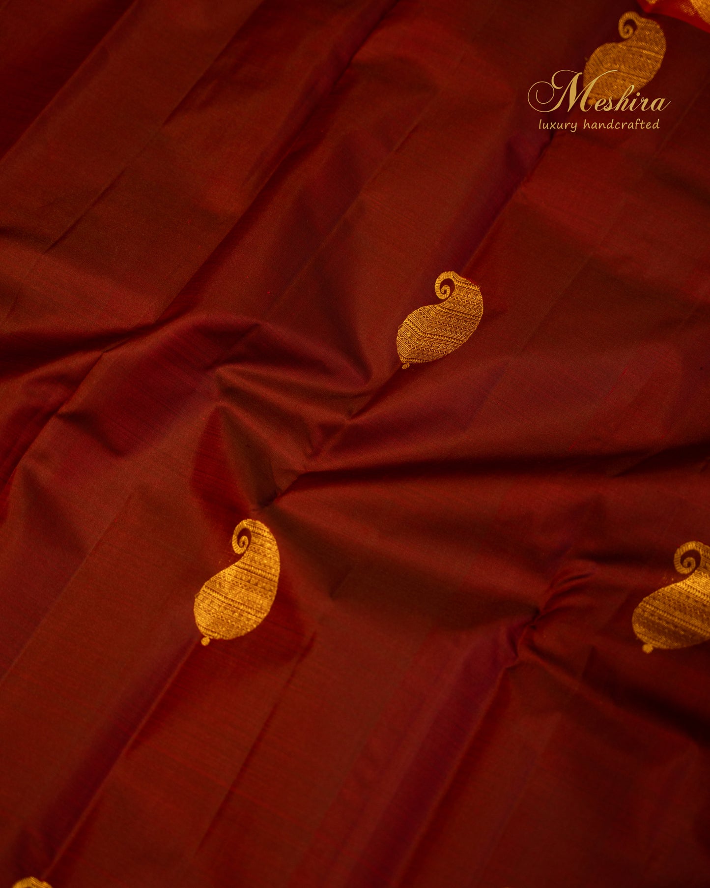 Crimson Kanchivaram silk saree with temple zari and gold pallu