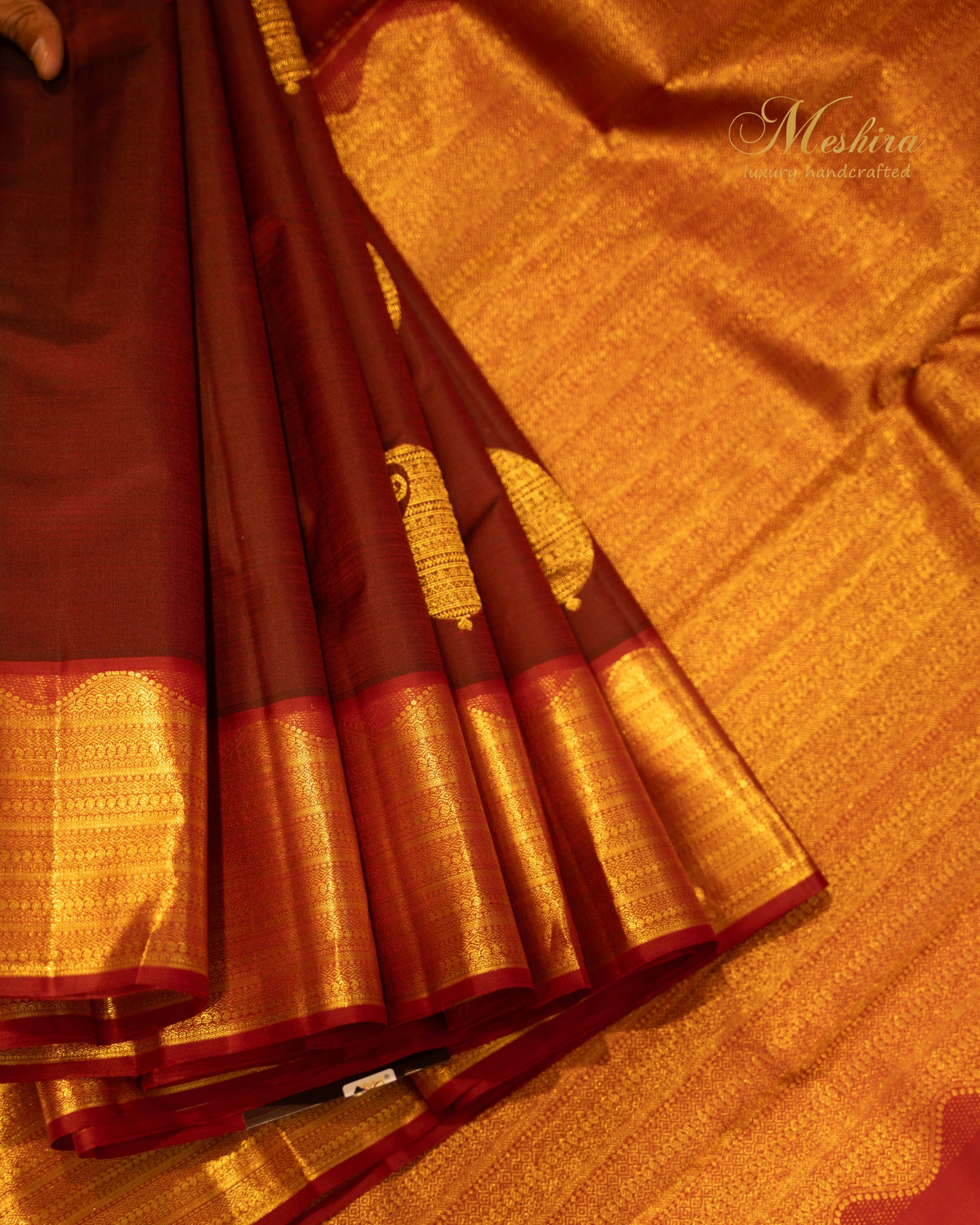 Crimson Kanchivaram silk saree with temple zari and gold pallu