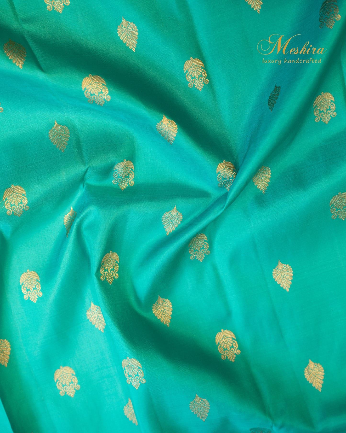 Turquoise blue Kanchivaram silk saree with zari motifs and contrast deep plum border
