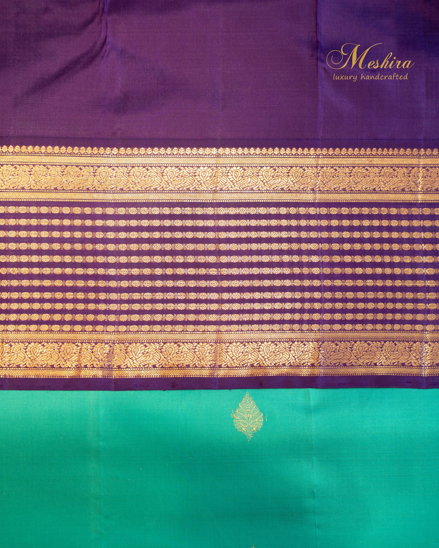Turquoise blue Kanchivaram silk saree with zari motifs and contrast deep plum border