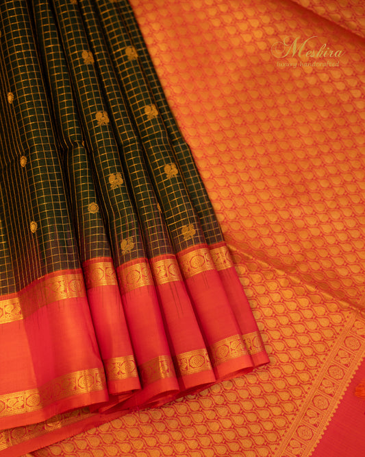 Radiant green Kanchivaram Silk Saree with a Striking Fiery Orange Pallu