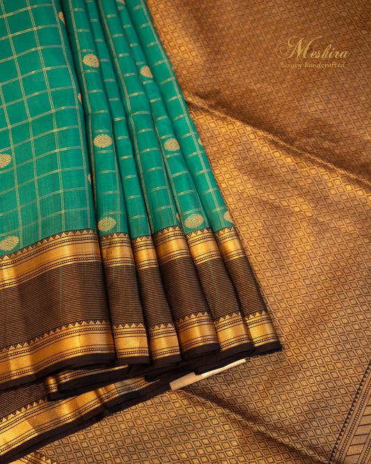 Regal Teal Kanchivaram Silk Saree with a Zari-Embellished mid night blue Border