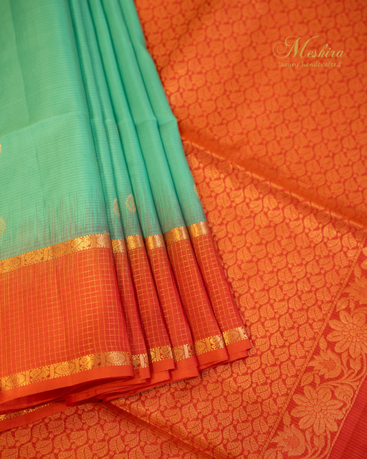 Radiant Varnam Aqua Green Kanchivaram Silk saree with Fiery orange Zari