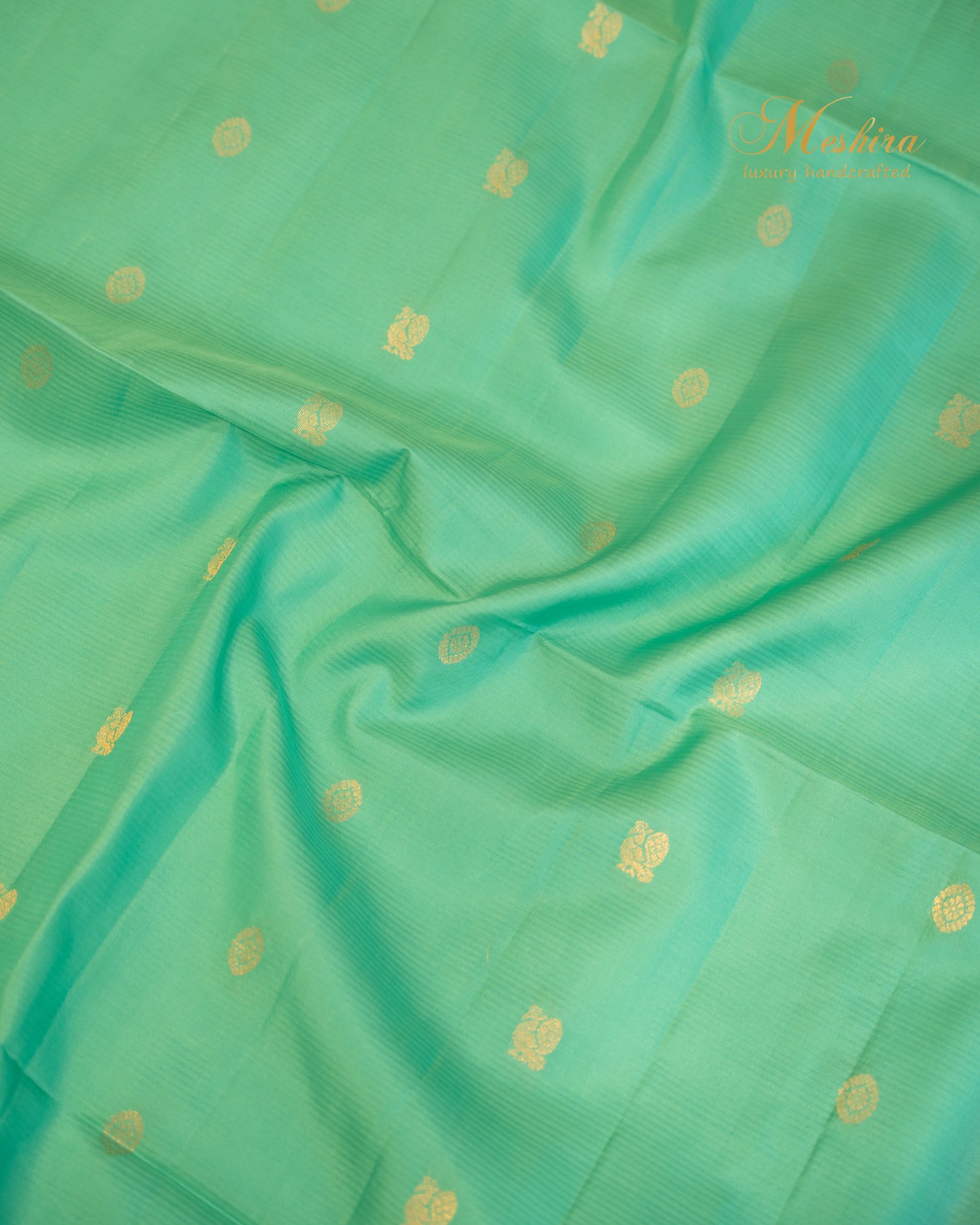 Radiant Varnam Aqua Green Kanchivaram Silk saree with Fiery orange Zari