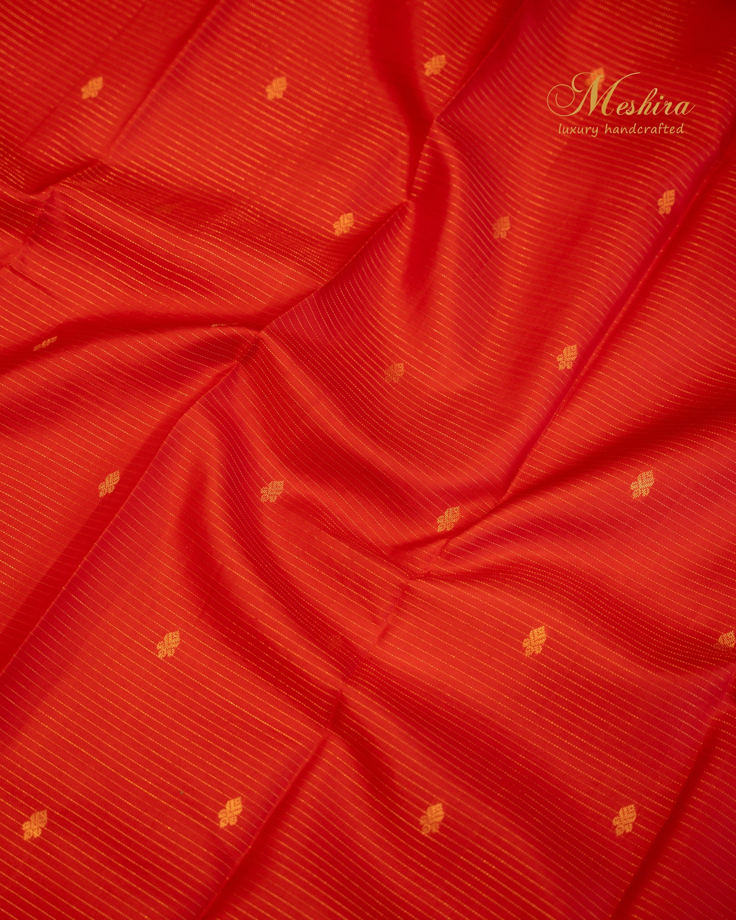 Radiant red Kanchivaram silk saree with turquoise pallu and zari work