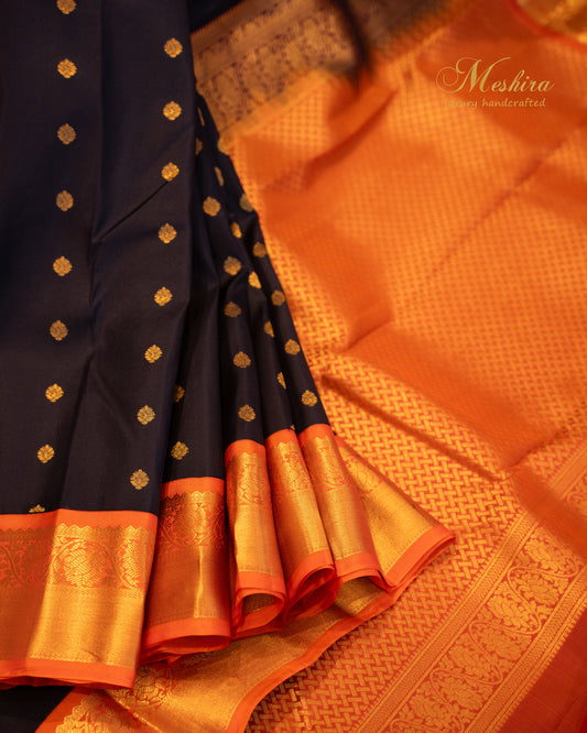 Ink blue Kanchivaram with Gold Buttas and Burnt Orange Brilliance
