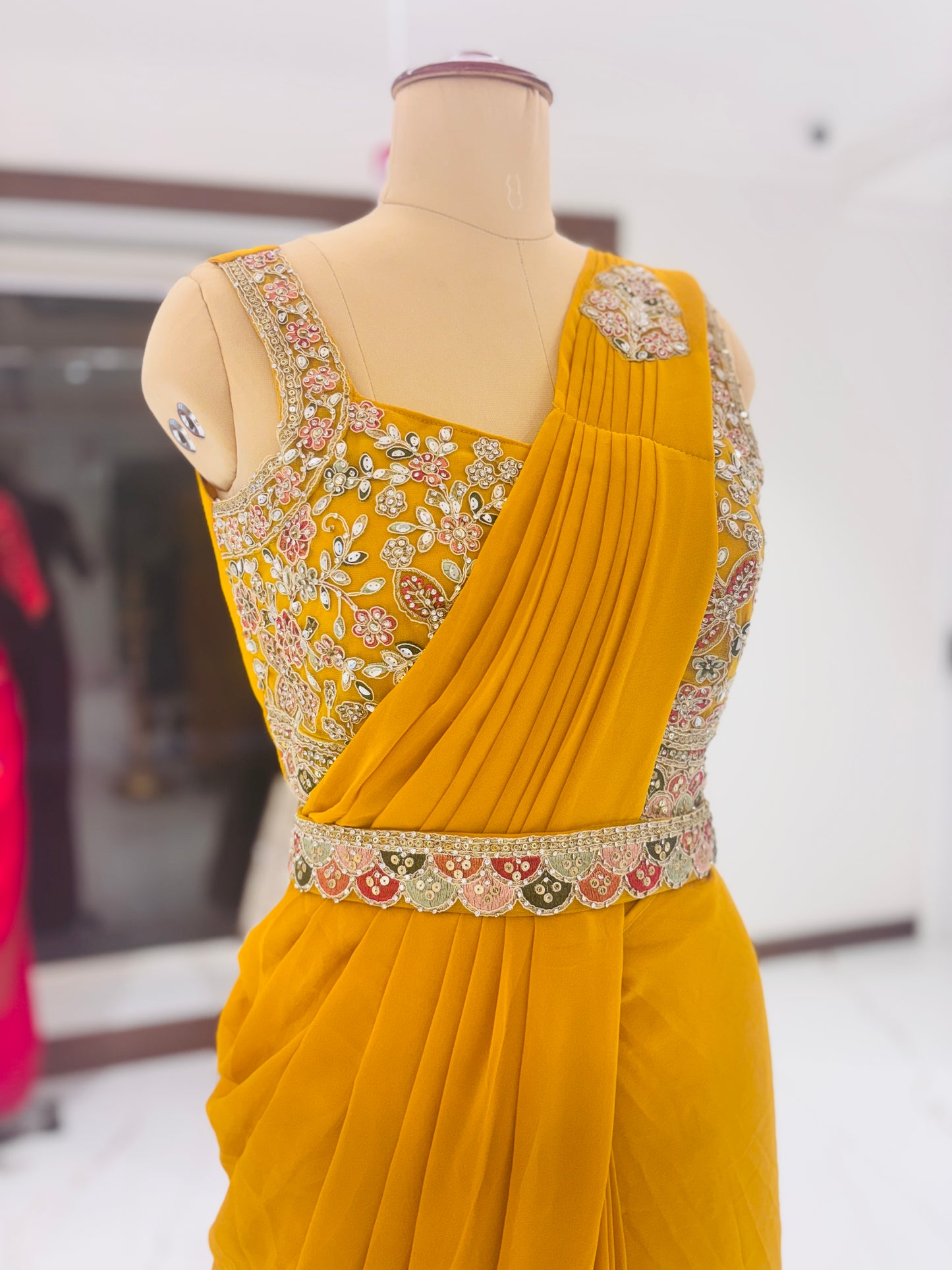 Yellow ready-made sari with embroidered blouse and belt
