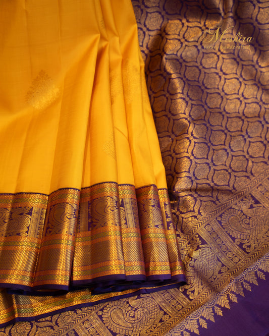 Sunshine yellow with royal purpose Kanchivaram silk saree.