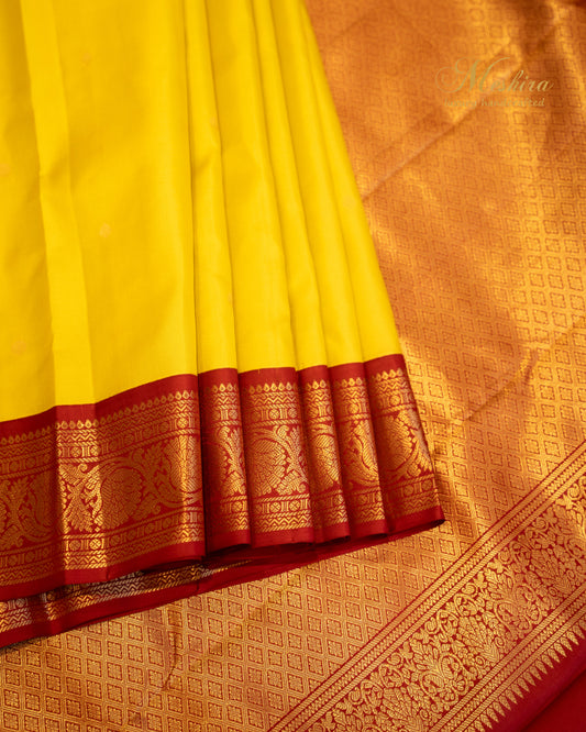 Turmeric yellow and Maroon Kanchivaram silk saree.