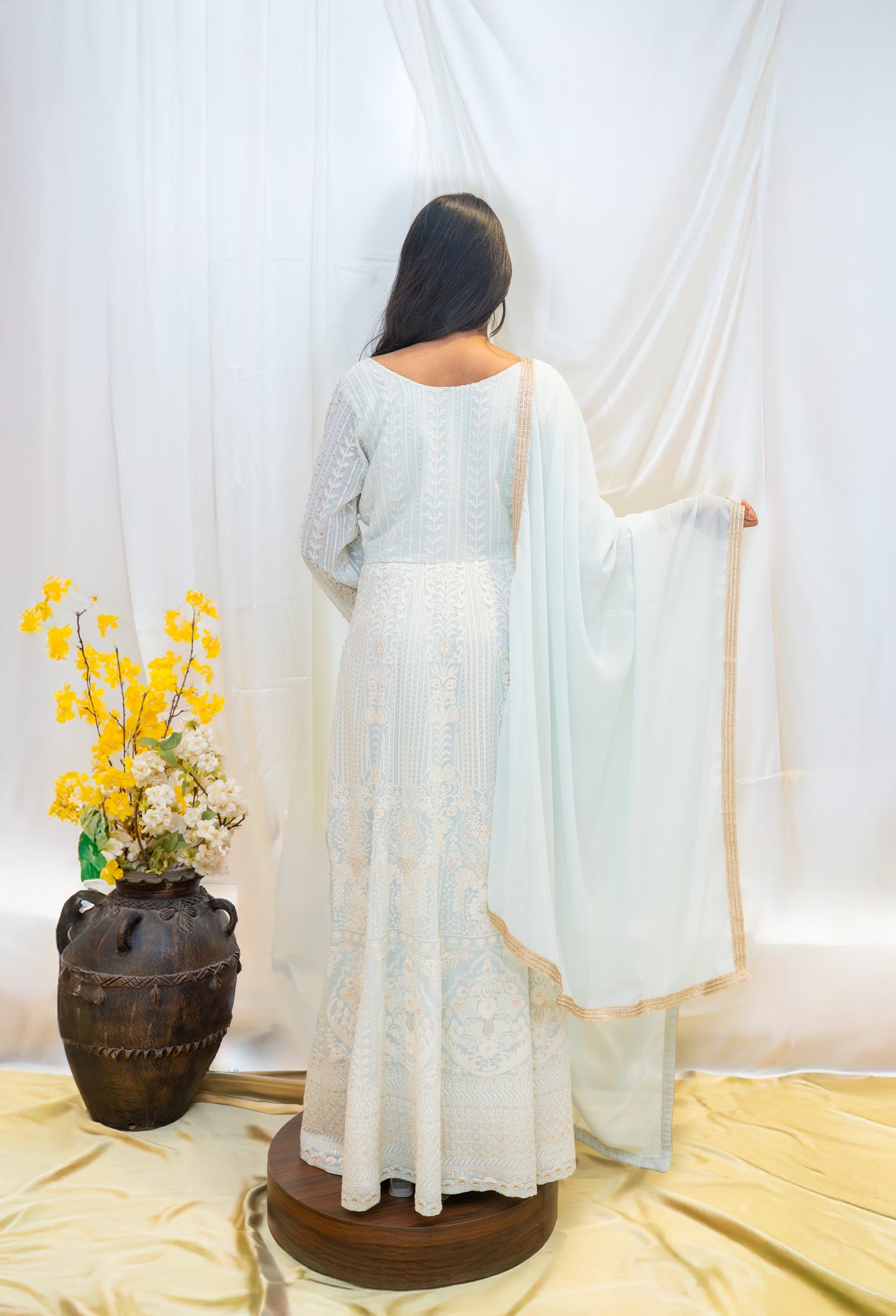 A serene ivory Anarkali adorned with delicate embroidery