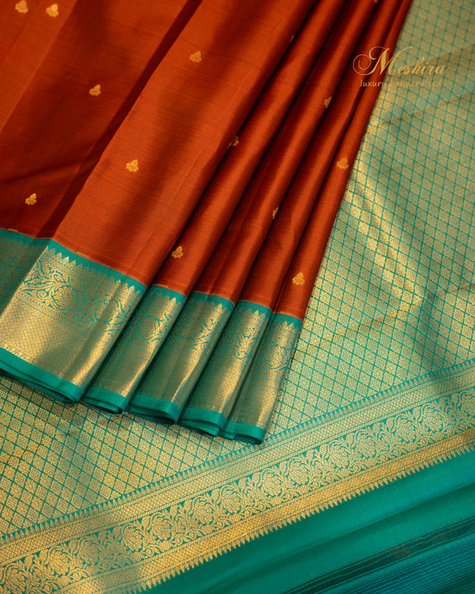 Rust & Sea Green Kanchivaram silk saree with golden buttas