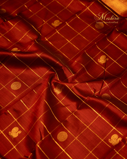 Maroon Kanchivaram Silk Saree with golden Zari in Bhavaji Border