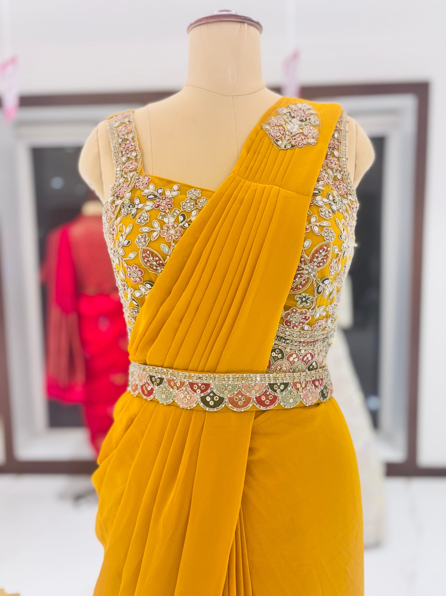 Yellow ready-made sari with embroidered blouse and belt