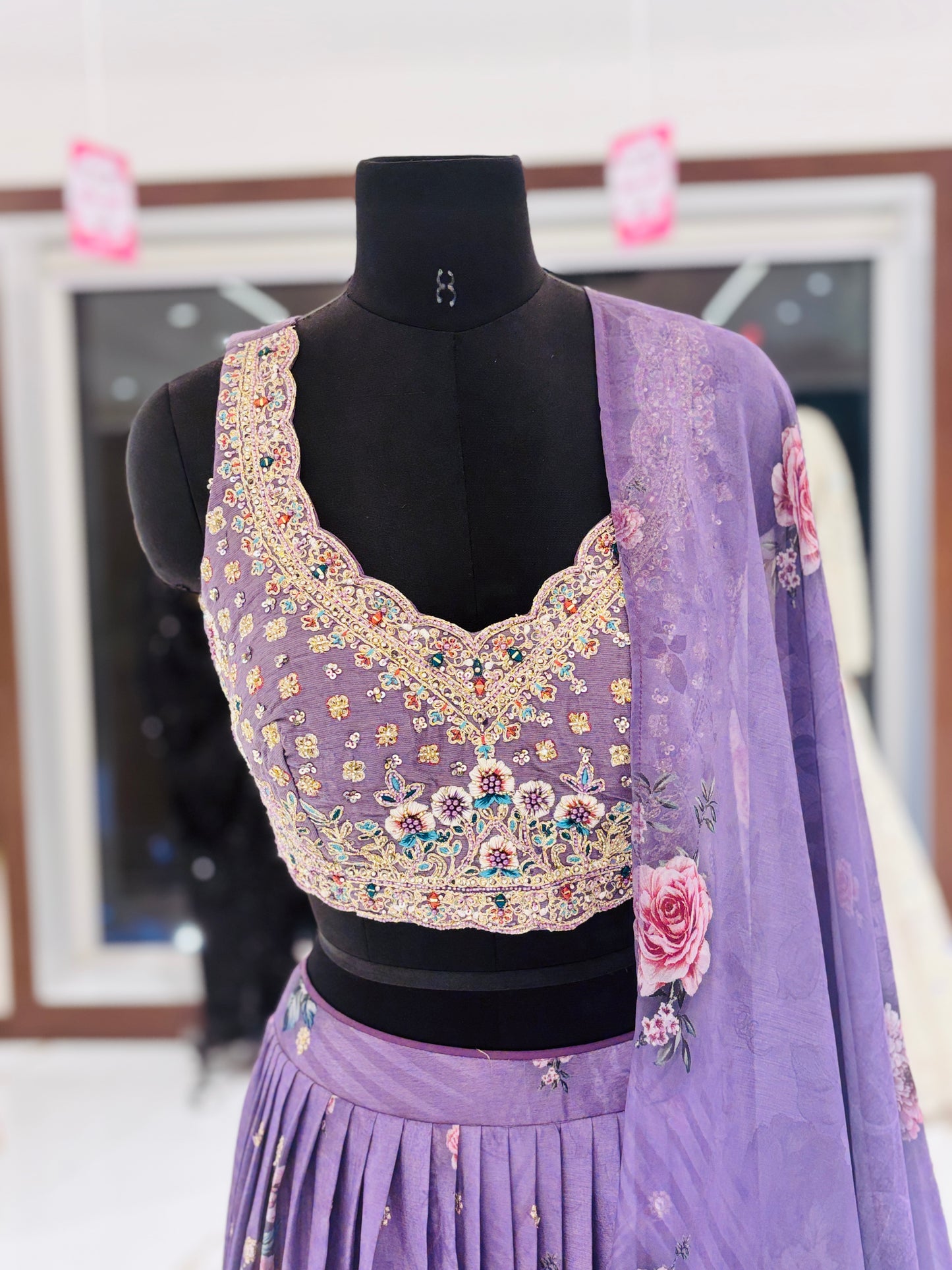 Lavender floral lehenga with embroidered blouse.