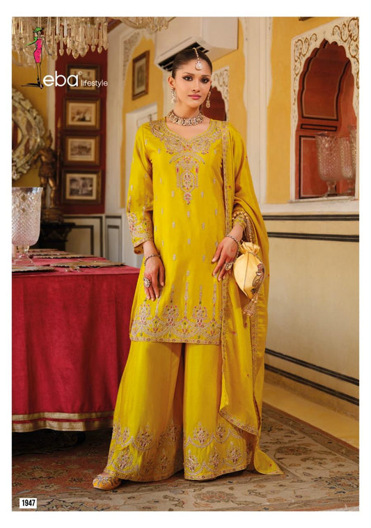 Traditional embroidered salwar kameez with dupatta in mustard colour.