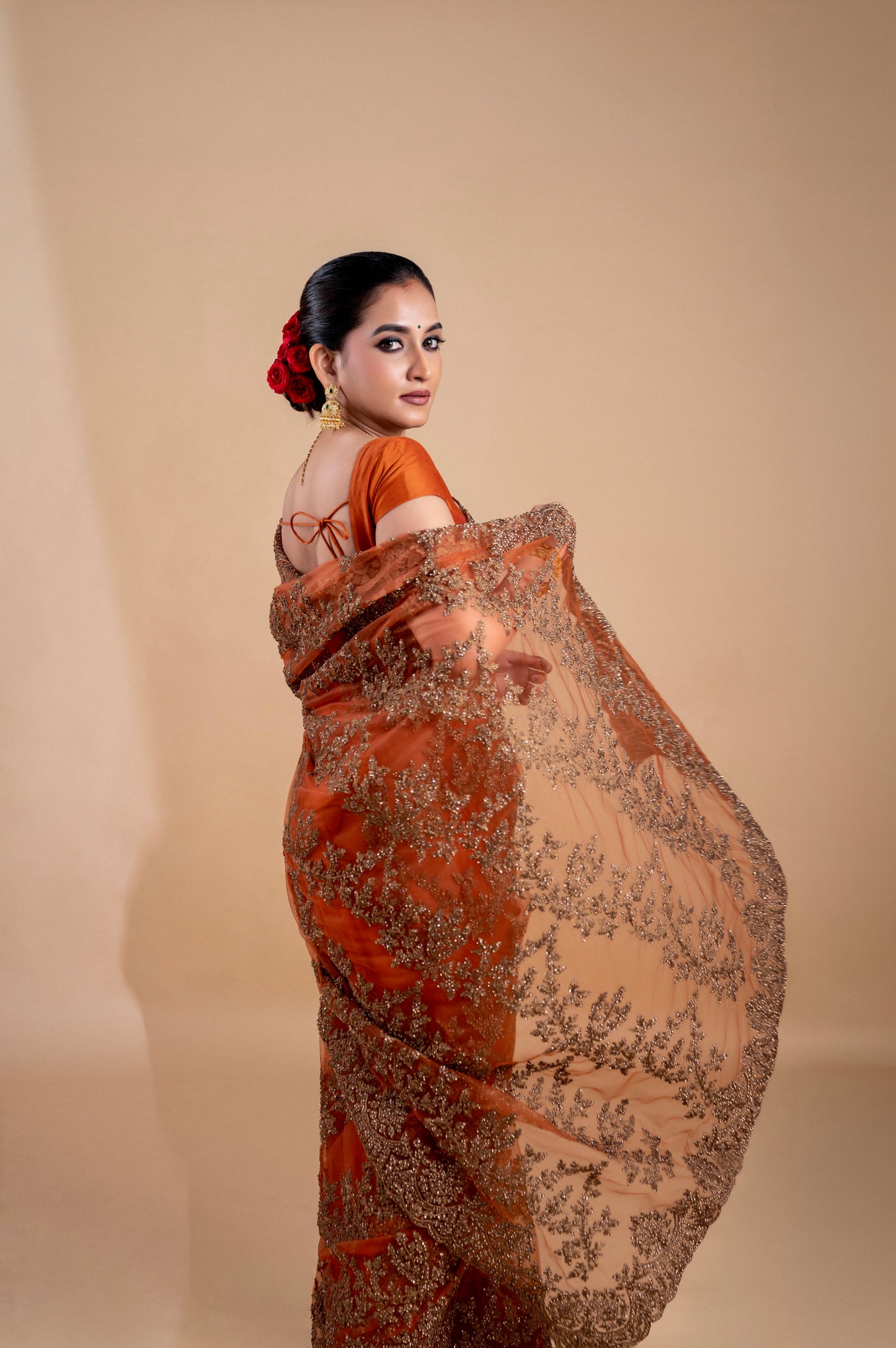 Elegant Rust Orange saree with intricate embroidery