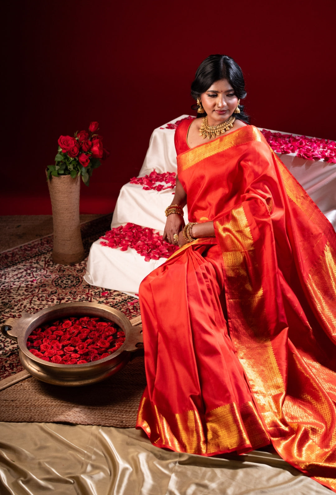 Red silk saree with zari work in the border