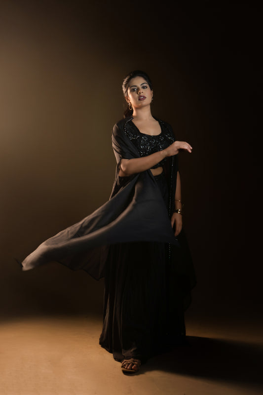 A Stunning black drape skirt lehenga with a jacket