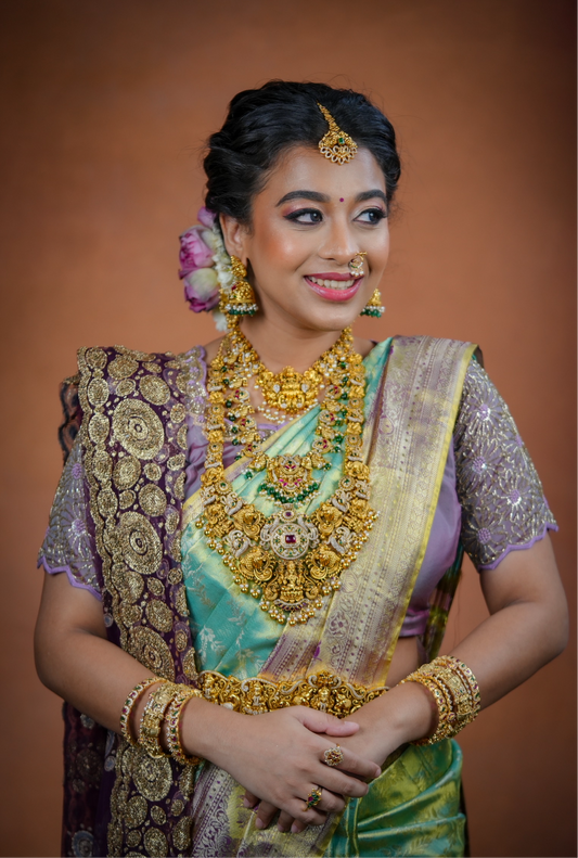 Turquoise blue Kanchivaram Silk Saree with brocade body and blouse.