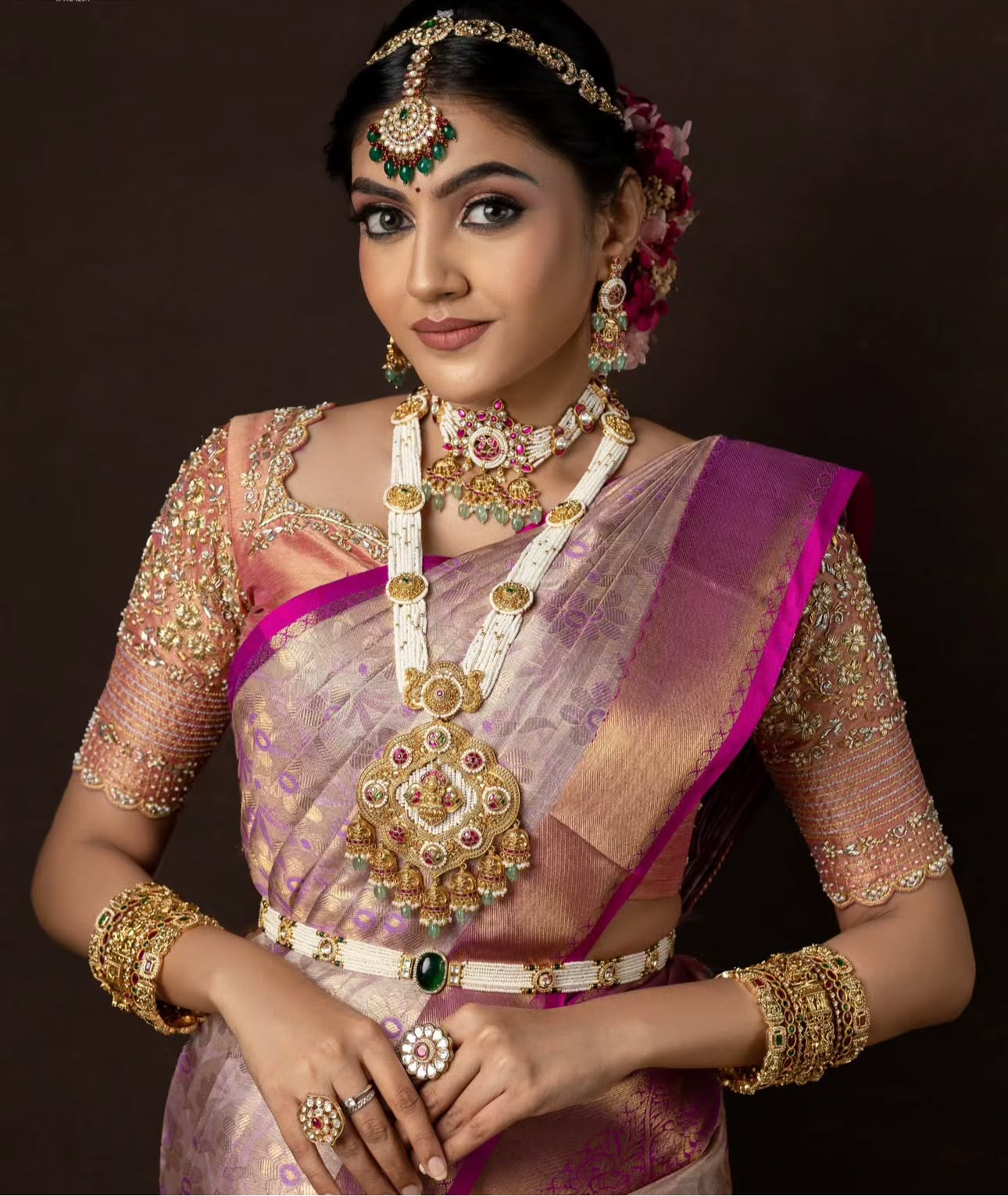 Bridal Kanchivaram silk saree in lavender and pink hues.