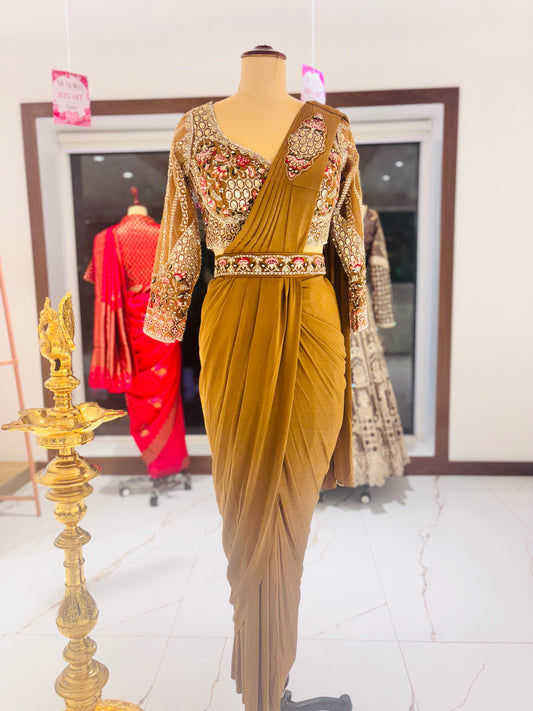 Gold ready made Saree with embroidered blouse.