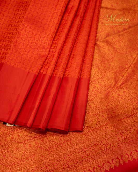 Vermilion flame Red Kanchivaram silk saree in self color border.