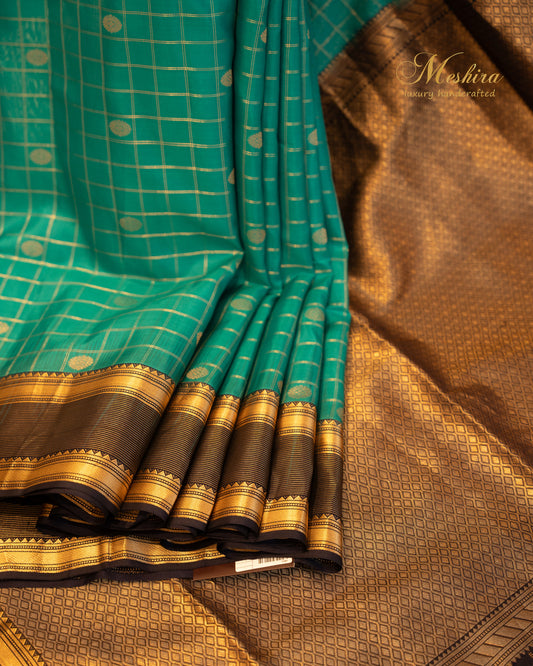 Regal Teal Kanchivaram Silk Saree with a Zari-Embellished mid night blue Border