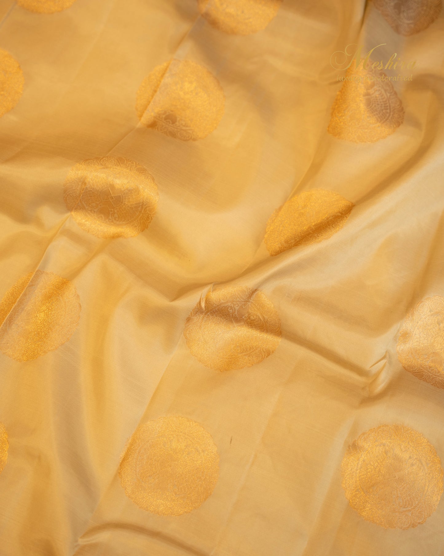 Golden Beige Kanchivaram silk saree with Zari Buttas and Pink Grandeur