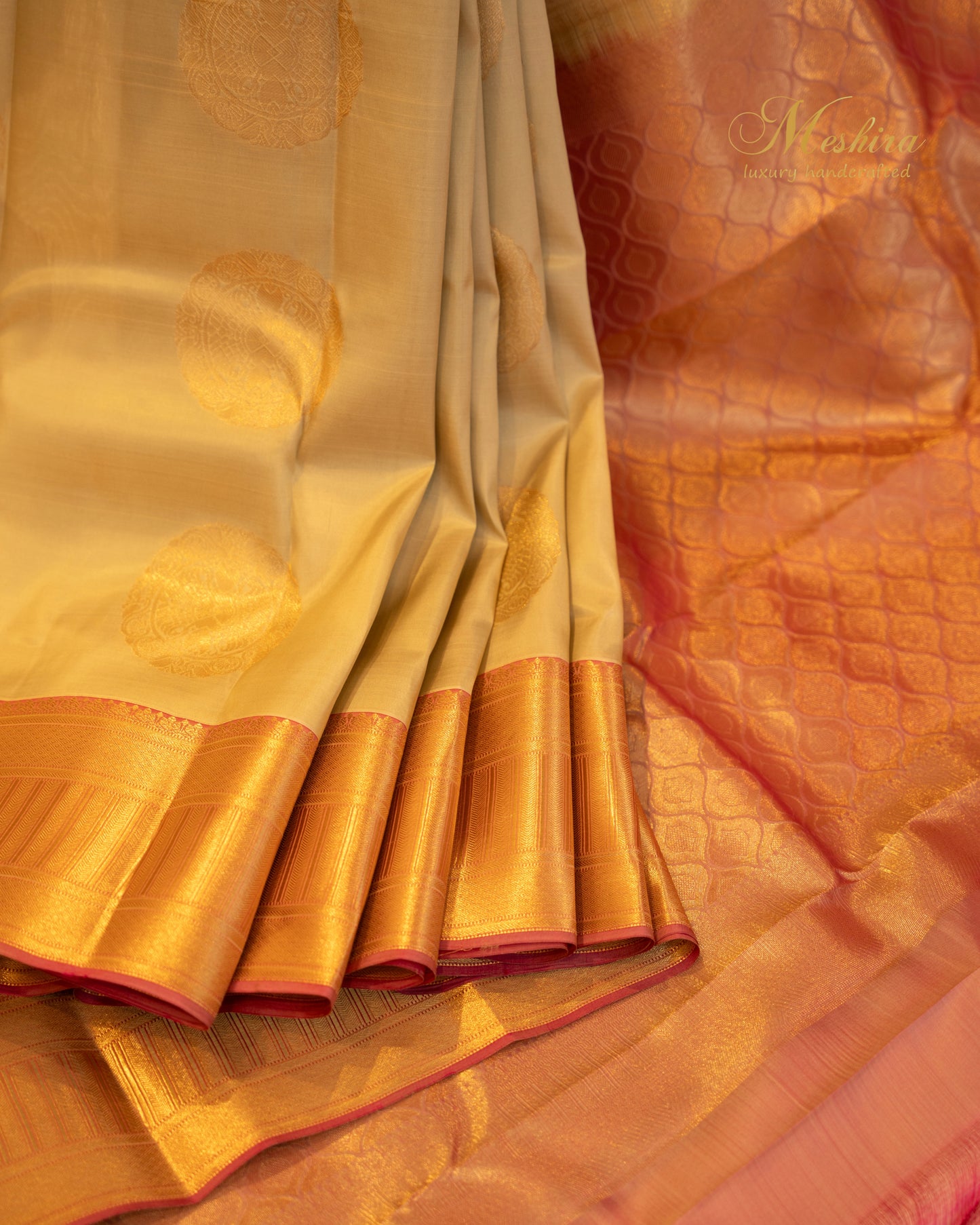 Golden Beige Kanchivaram silk saree with Zari Buttas and Pink Grandeur