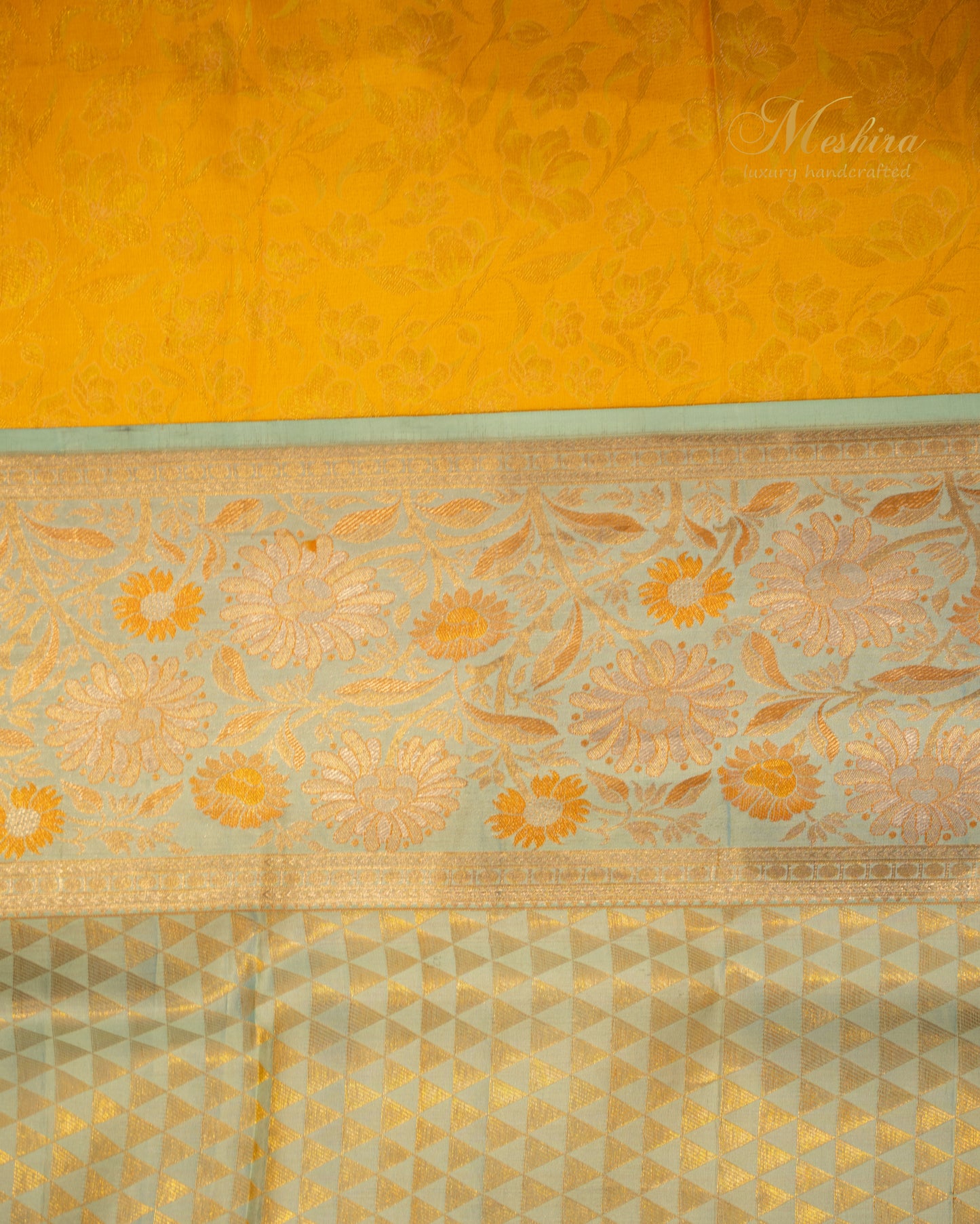 Sunflower yellow Kanchivaram silk saree accented with aqua and gold zari