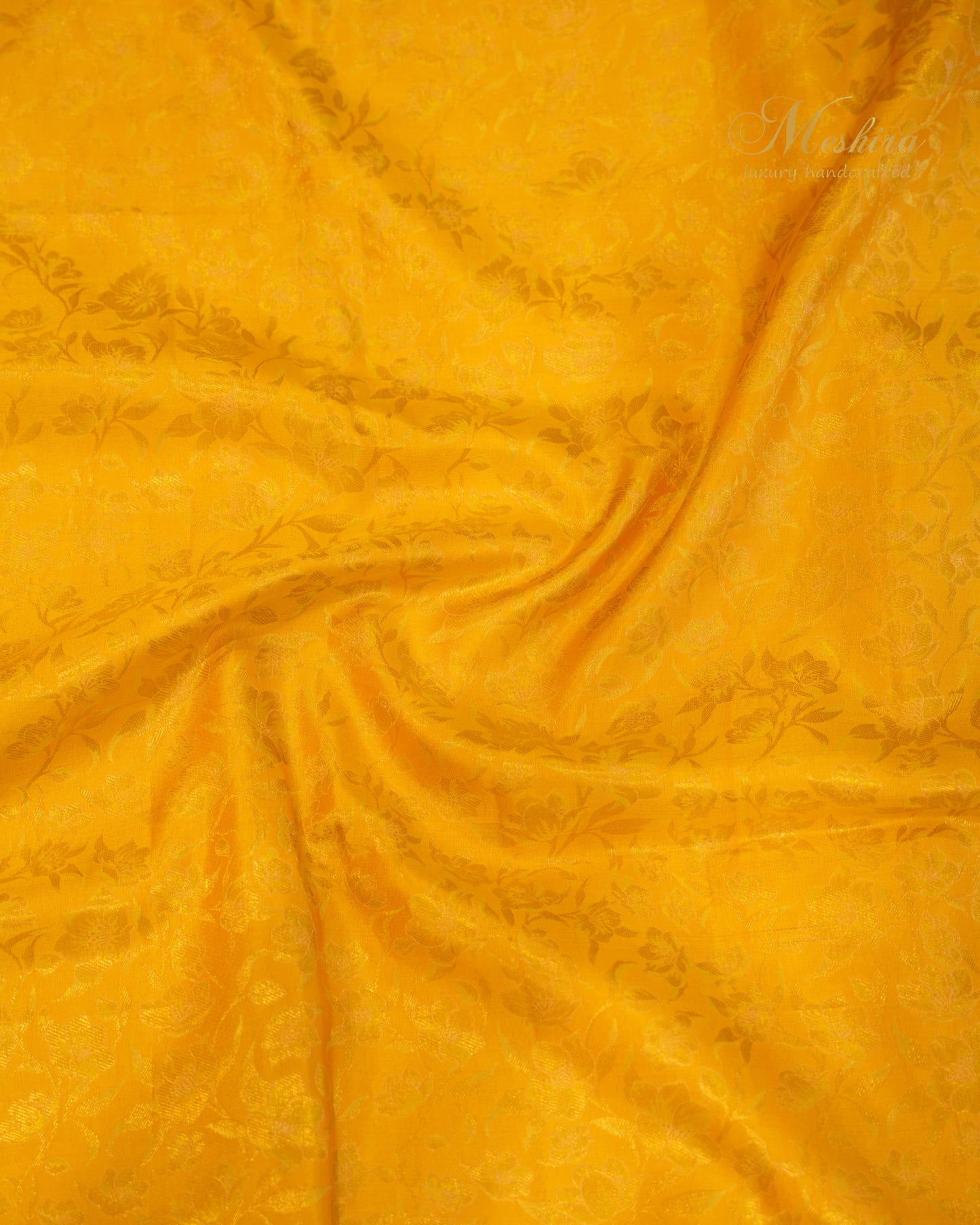 Sunflower yellow Kanchivaram silk saree accented with aqua and gold zari