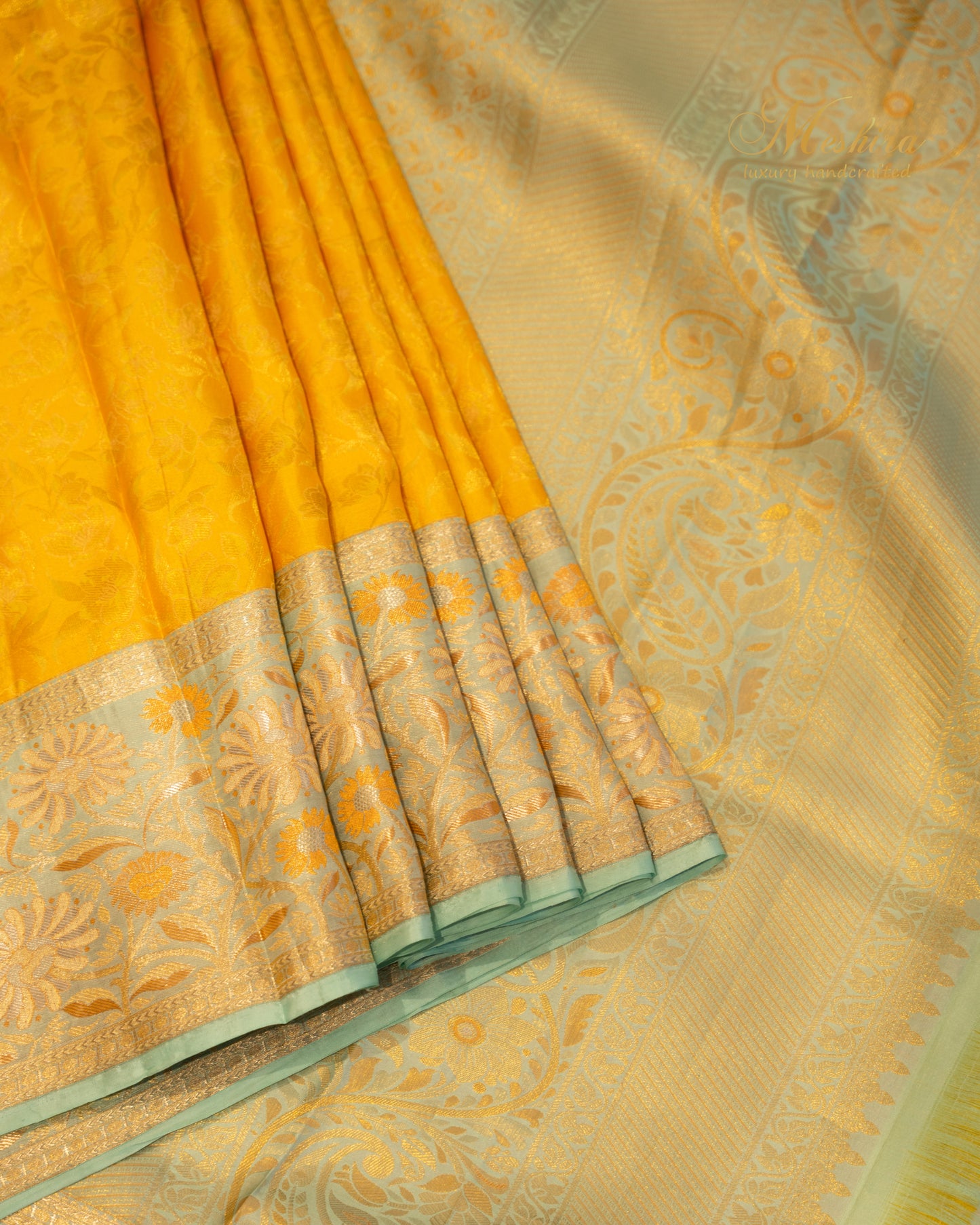 Sunflower yellow Kanchivaram silk saree accented with aqua and gold zari