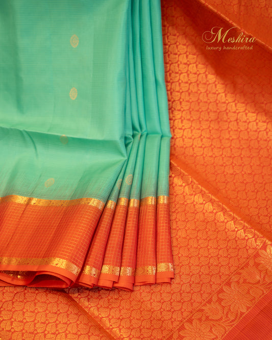 Radiant Varnam Aqua Green Kanchivaram Silk saree with Fiery orange Zari
