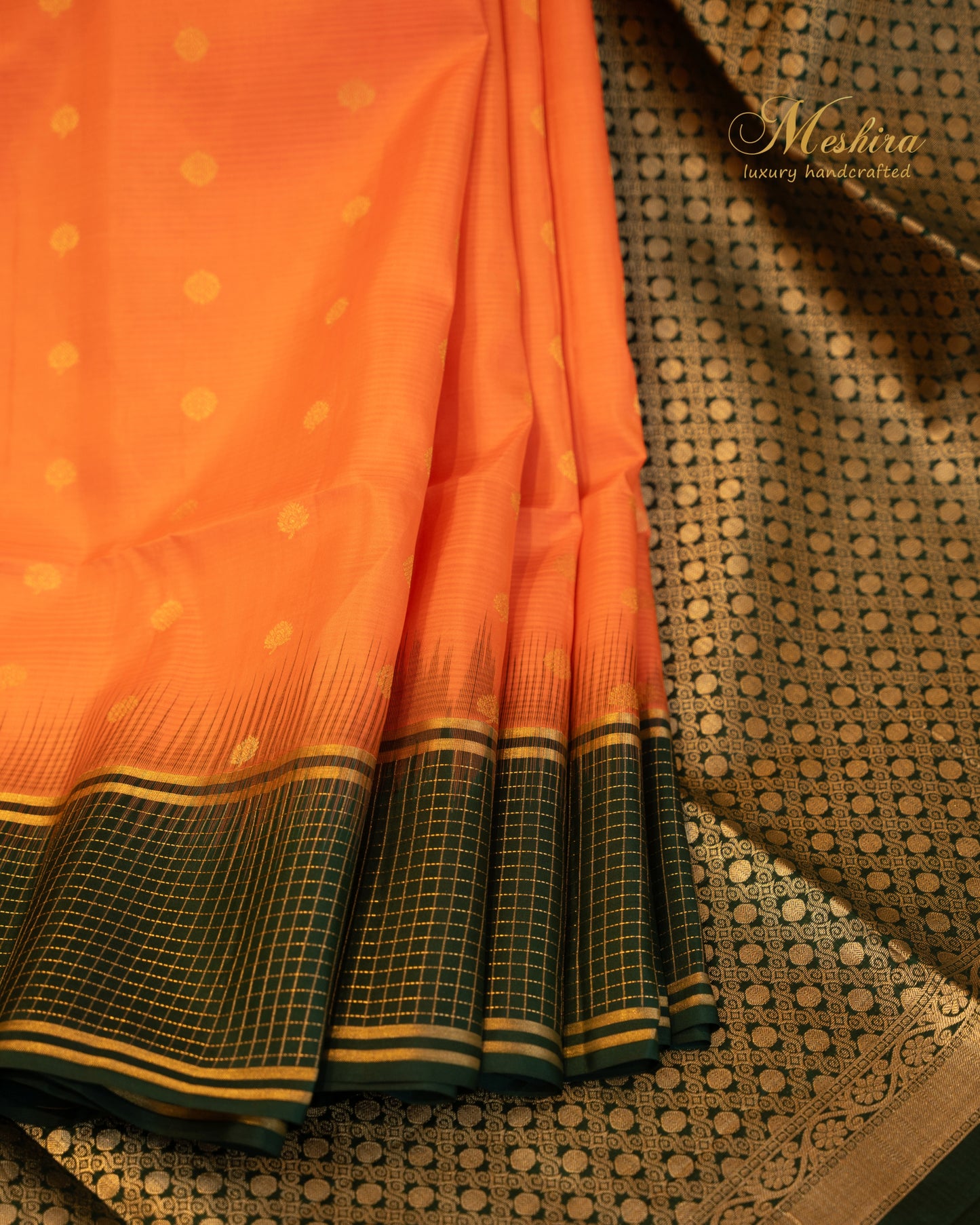 Luminous Orange Kanchivaram Silk saree Draped in Bold green and Gold Zari