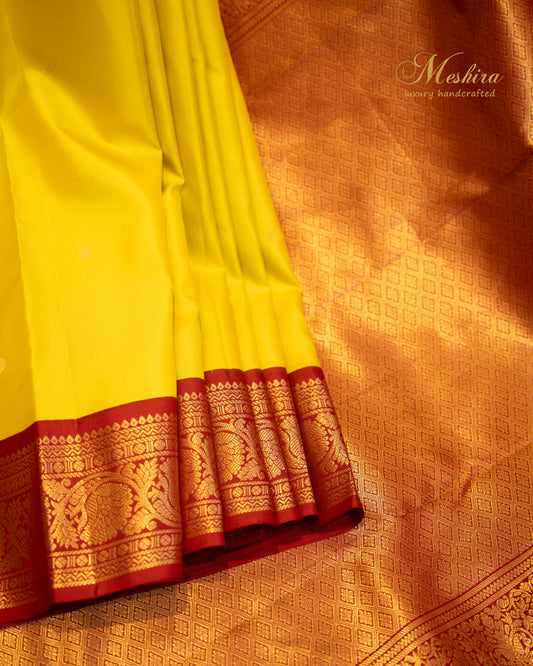 Turmeric yellow and Maroon Kanchivaram silk saree.
