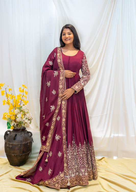 A regal maroon Anarkali enriched with intricate golden embroidery