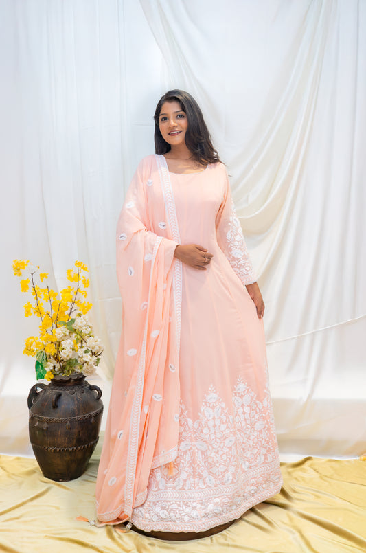 A soft peach Anarkali adorned with delicate white thread embroider