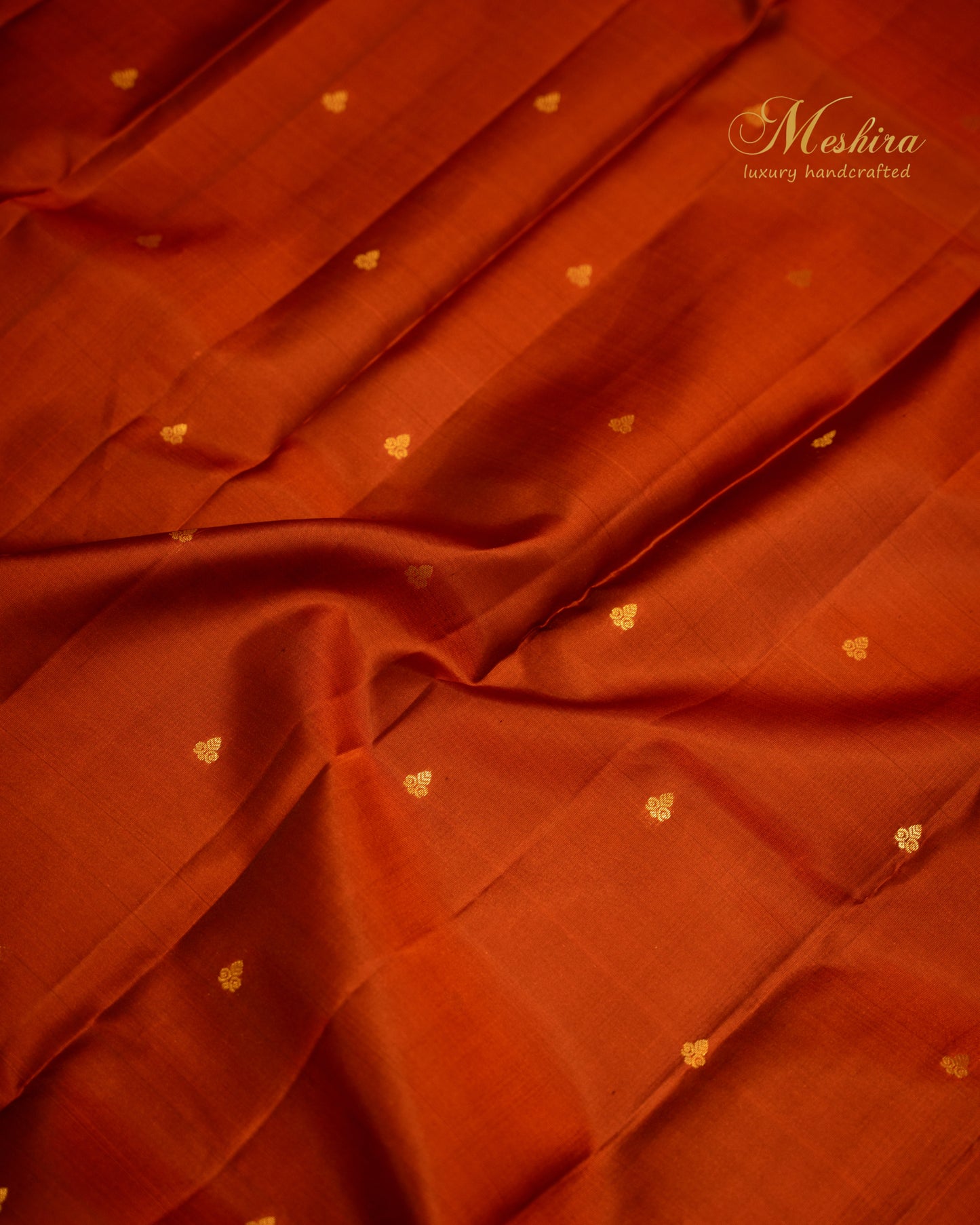 Rust & Sea Green Kanchivaram silk saree with golden buttas