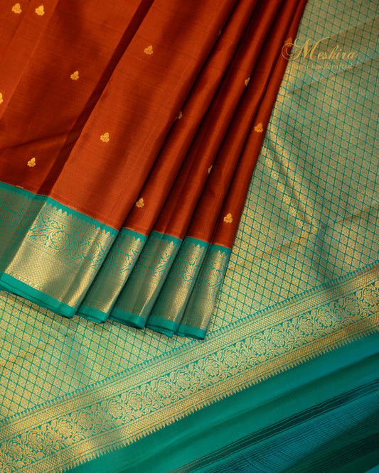 Rust & Sea Green Kanchivaram silk saree with golden buttas