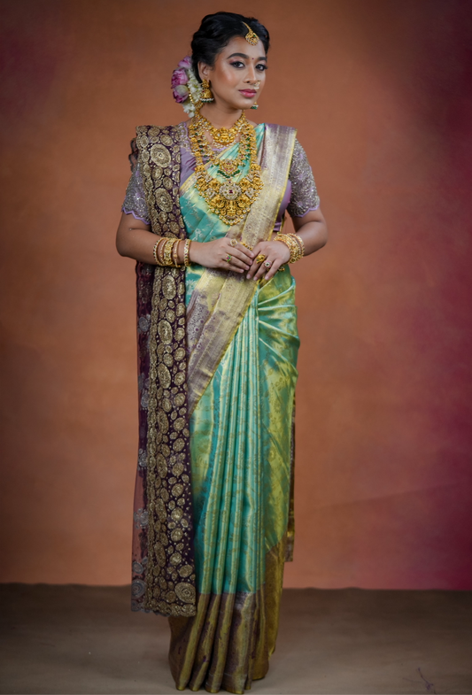 Turquoise blue Kanchivaram Silk Saree with brocade body and blouse.